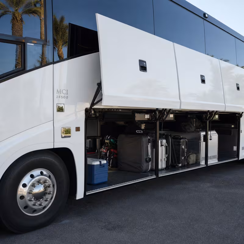 Party bus interior with wraparound leather seating and LED lighting in Davie