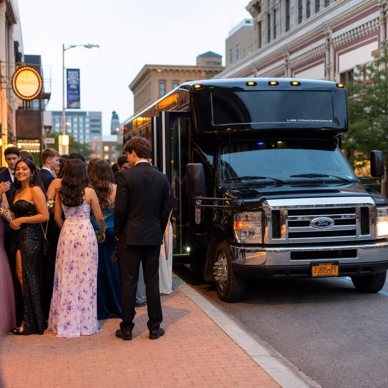 Passengers loading luggage while boarding an Davie group shuttle