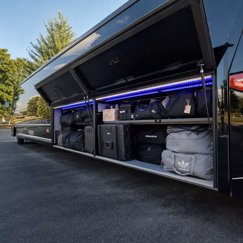 Party bus interior with wraparound leather seating and LED lighting in Davie