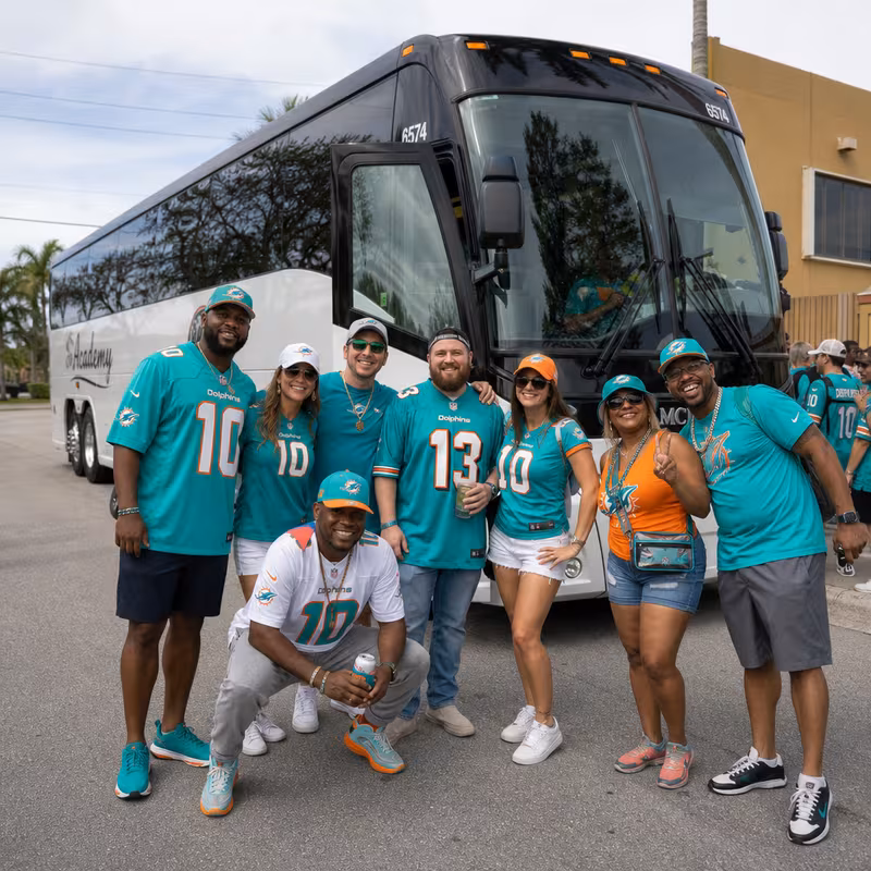 Passengers loading luggage while boarding an Davie group shuttle