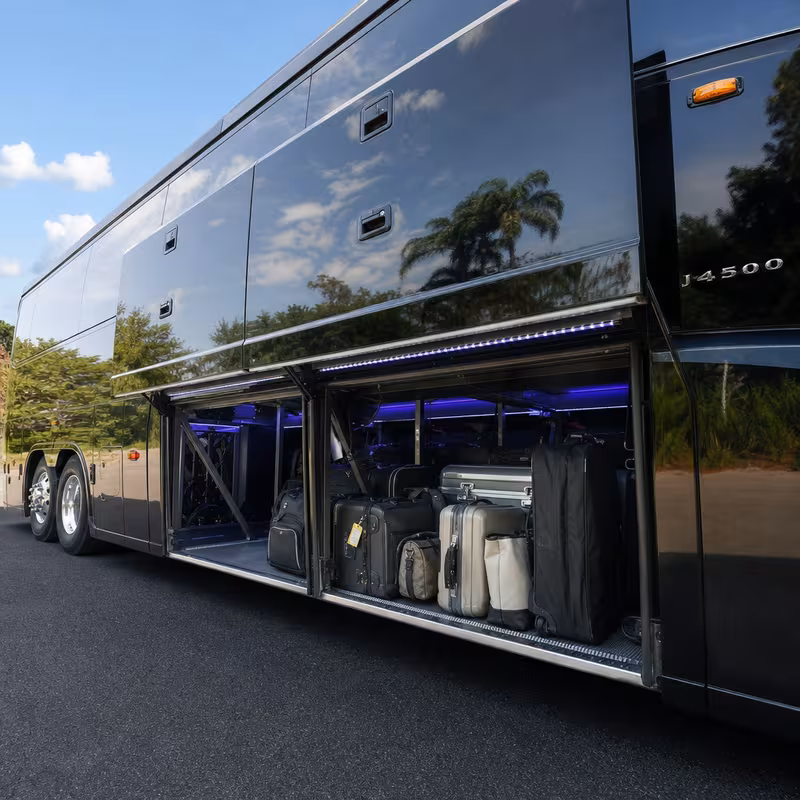 Party bus interior with wraparound leather seating and LED lighting in Davie