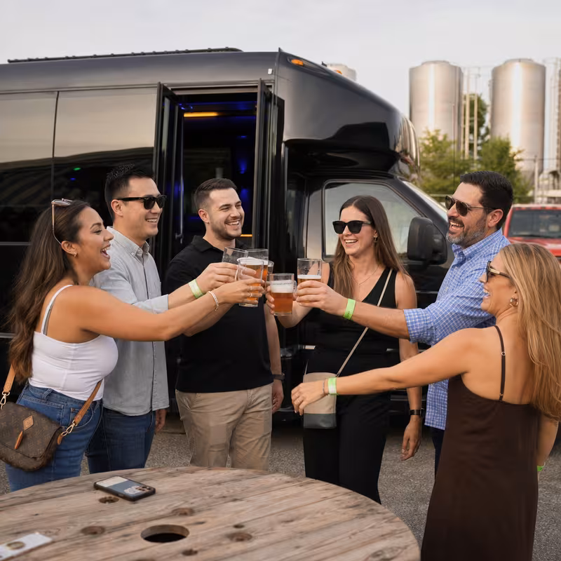 Passengers loading luggage while boarding an Davie group shuttle